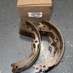 Genuine Nissan 440601PA0B - Parking Brake Shoe (rear). Fixed Price $65.00.